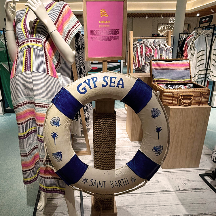 lemlem at le bon marche pop up close up on a white and blue buoy  wit GypSea Saint Barth written on it
