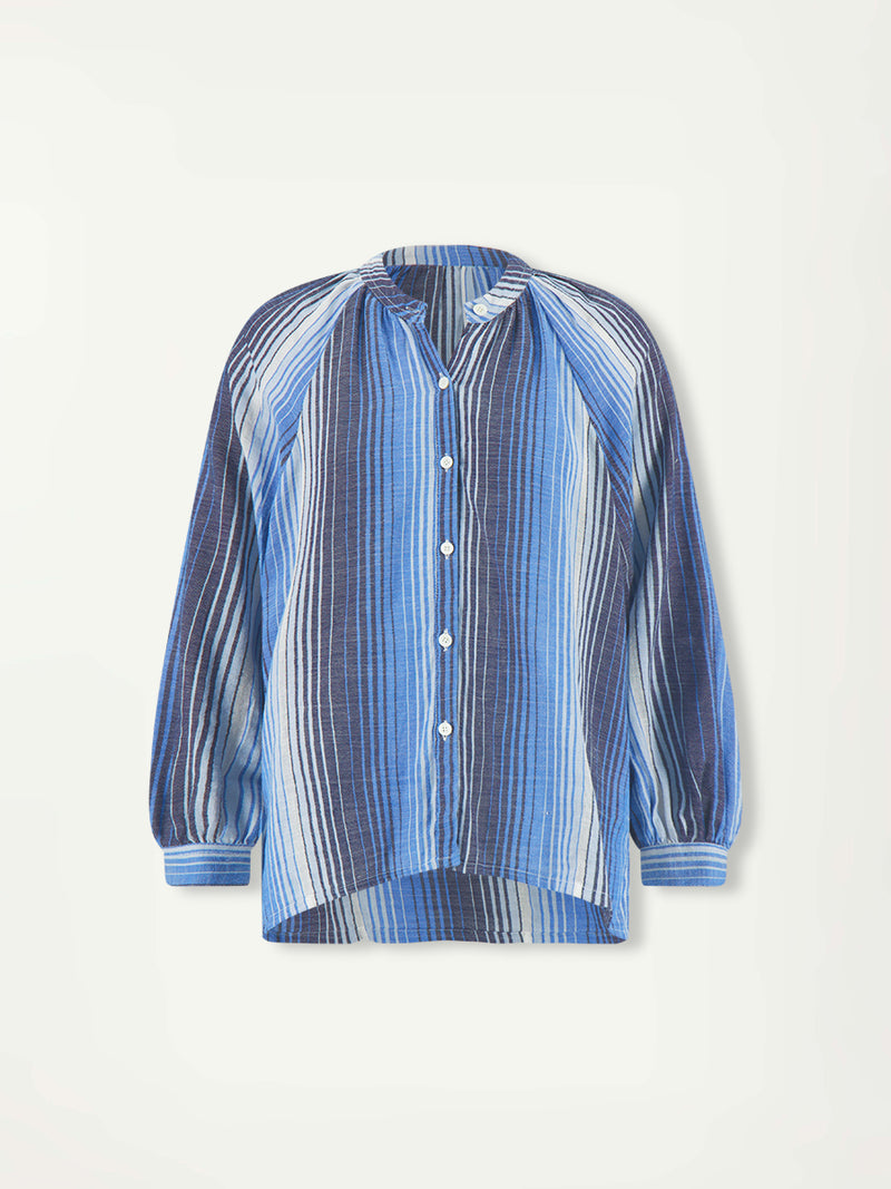 Product Front Shot of lemlem MITA Blouse featuring carefully placed stripes that blend into a stunning ombré effect, with soft transitions between white, sky blue, mid blue, and deep navy.